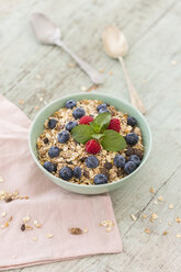 Bowl of muesli with raspberries and blueberries - JUNF01094