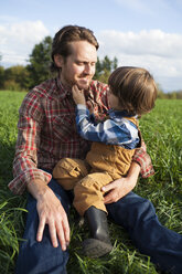 Young boy playing with his fathers beard. - AURF02180