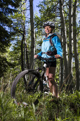Woman mountain biking - AURF02229