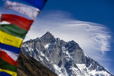 Prayer flags with Lhotse Shar (8386m) in the distance, Sagarmatha National Park, Khumbu region, Nepal. - AURF02302