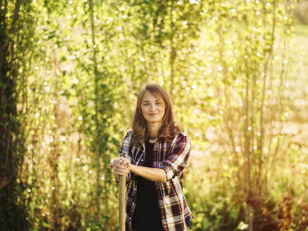 Portrait of smiling farmer on a field - RAMAF00050