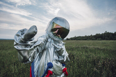 Spaceman exploring nature, giving the finger - VPIF00587