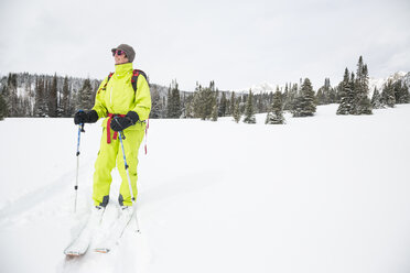 A fit female backcountry skier in the Beehive Basin near Big Sky, Montana. - AURF02657