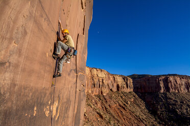 A man rock climbing in Indian Creek, Monticello, Utah. - AURF02695