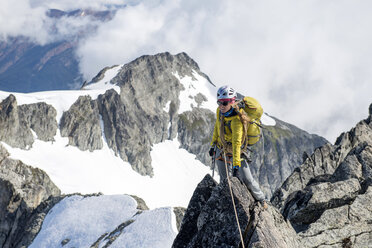 Woman climbing on the North Ridge of Forbidden Peak in North Cascades National Park. - AURF02833