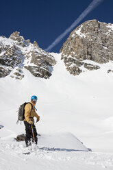 A backcountry skier after skiing Fourth of July┬áCouloir in the Beehive Basin near Big Sky, Montana. - AURF02926