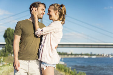 Happy affectionate couple at the riverside in summer - JOSF02657