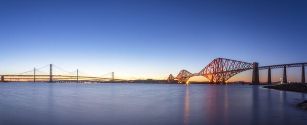 UK, Scotland, Edinburgh, Forth Bridge and Queensferry Crossing Bridge at sunset - SMAF01139