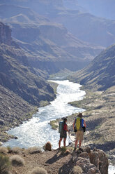 Hikers overlook the Colorado River as they follow a route that connect Tapeats Creek and Thunder River to Deer Creek in the Grand Canyon outside of Fredonia, Arizona November 2011. - AURF03229