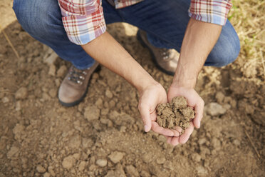 Farmer holding soil in his hands - ABIF00942