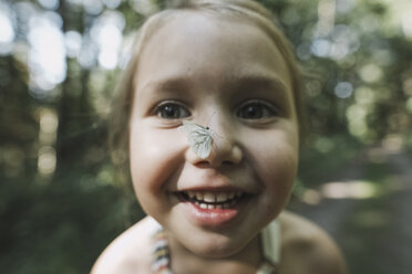 Portrait of smiling little girl in nature stock photo