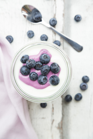 Glass of Greek yogurt with blueberries stock photo