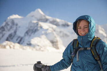 Portrait of a young woman snowshoeing with Mount Shuksan in the background. - AURF03489