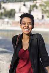 Portrait of laughing young woman - GIOF04258