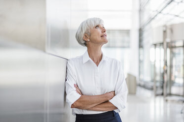 Portrait of senior businesswoman looking up - DIGF05025