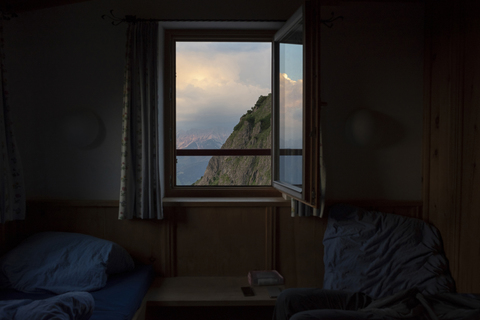 Austria, Tyrol, Fieberbrunn, view out of bedroom of a mountain hut on mountain stock photo