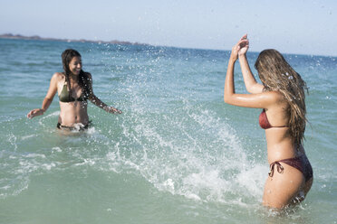 Happy carefree friends splashing in the sea - PACF00082