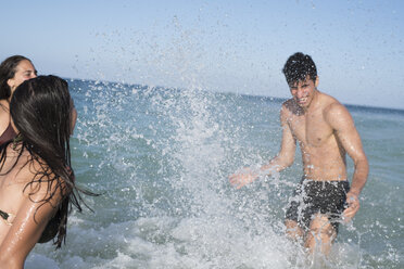 Happy carefree friends splashing in the sea - PACF00084