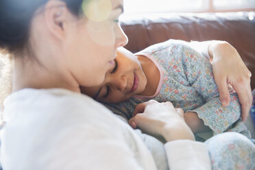 Affectionate, tender mother and daughter cuddling - HOXF03926