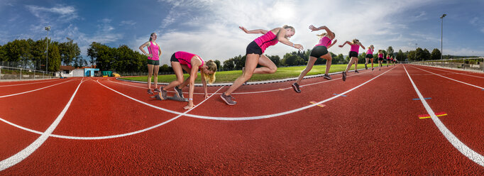 Female athlete in starting position on running track - Stock Image -  F019/1306 - Science Photo Library