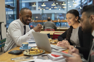 Business people meeting, working at laptop in cafe - CAIF21966