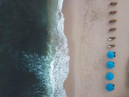 Indonesia, Bali, Aerial view of Balangan beach, empty sun loungers - KNTF01414