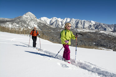 A mother and daughter backcountry skiing in the San Juan National Forest, Durango, Colorado. - AURF04036