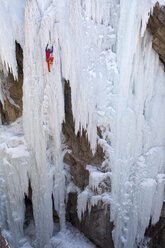 A man ice climbing near Ouray, Colorado. - AURF04043