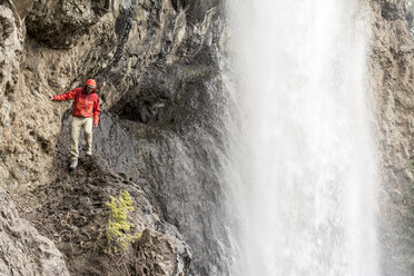 A man hiking below Treasure Falls, San Juan National Forest, Pagosa Springs, Colorado. - AURF04053