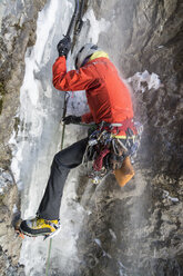 A woman ice climbing near Ouray, Colorado. - AURF04104