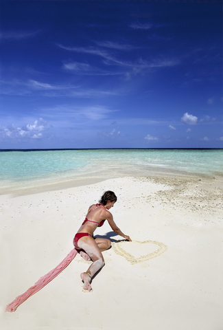 Young woman walking on sandbank beach, Maldives, Indian Ocean, Asia, Maafishi stock photo