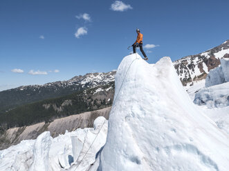 A climber on a serac on Mount Baker in Washington. - AURF04462