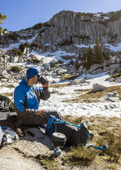 A Man Cooks Breakfast And Enjoys His Coffee While Camping In The Lone Peak Wilderness In Utah's Wasatch Mountains - AURF04488