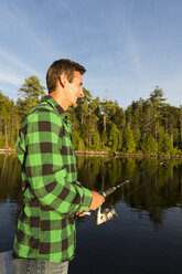 A Man Fishing On Long Pond Near The Appalachian Lodge, Greenville, Maine - AURF04503