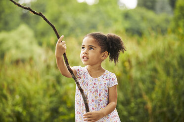 A Portrait Of A Young Girl Playing With A Stick. - AURF04541