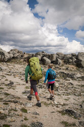 A mother and her young daughter backpacking in Cathedral Lakes Provincial Park, British Columbia, Canada. - AURF04551