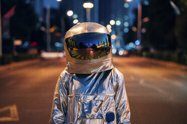 Spaceman on a street in the city at night - VPIF00712