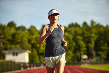 A woman running on a track. - AURF04608