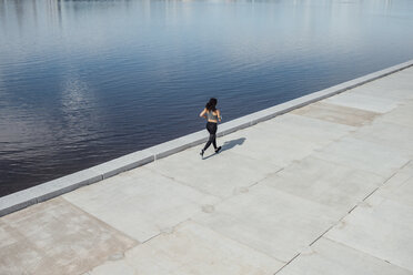 Young athletic woman running at the riverside - VPIF00794