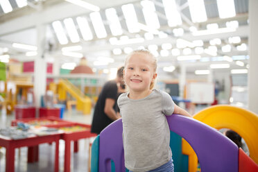 Portrait cute girl playing in science center - CAIF22063