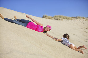 Mother and baby daughter playing at┬áSao┬áJacinto┬áDunes Natural Reserve beach - AURF04729