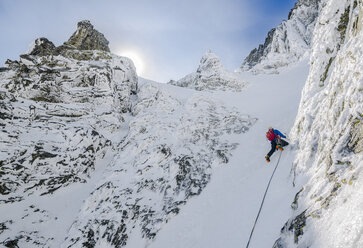 Mountain climber on easy pitch of Dobrucki route on Vysoka, High Tatras, Slovakia - AURF04786