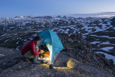Man camping above Stony Pass, Silverton, Colorado, USA - AURF04798