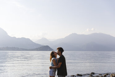 Happy affectionate young couple at the lakeside - MRAF00268