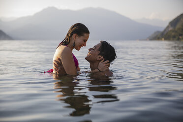 Happy affectionate young couple in a lake - MRAF00283
