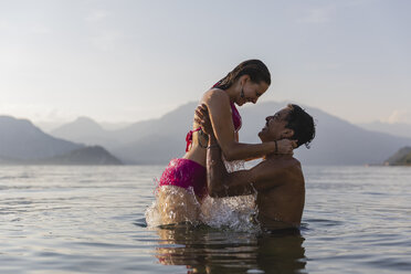 Happy affectionate young couple in a lake - MRAF00284