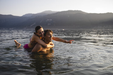 Happy carefree young couple in a lake - MRAF00299