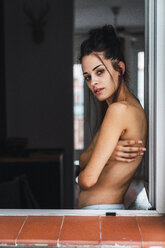 Portrait of beautiful barechested young woman at the window - KKAF01857