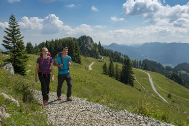 Germany, Bavaria, Brauneck near Lenggries, young couple hiking in alpine landscape - LBF02088