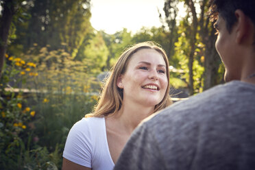 Happy young couple flirting in a park in summer - SRYF00799